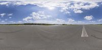 three different types of street skateboards sitting on an airport tarmac under blue skies