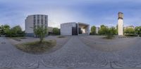 a 360 - degree lens panorama is showing the building in front of the fountain and the park