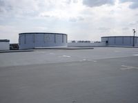 a boat is parked in an empty parking lot near an air port on the water