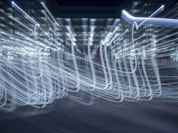 some lights are spinning in a long - exposure photo taken in the daytime hours as the long exposure photograph reflects light