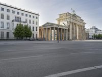 a photo of a building that looks like an architectural structure with columns and pillars, in front of buildings