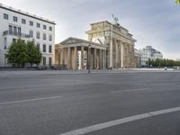 a photo of a building that looks like an architectural structure with columns and pillars, in front of buildings