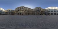 a 360 - view photo of the city in germany with several buildings and street signs