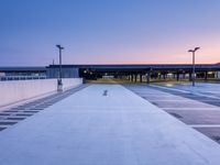 an empty parking lot that's empty and empty during the day with a sky background