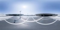 there is a circular photo of a train station and the sky above them's horizon