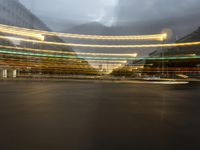 blurred, out - of - focus view of street lights in an urban area with large buildings