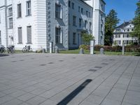 the shadows of buildings are cast from a shadow on the pavement near the street,