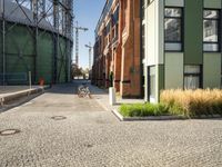 a large industrial water tank sits in front of the building site for an oil field