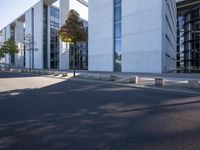 there is an empty parking area next to the building as seen from a side view