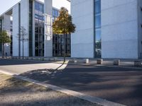 there is an empty parking area next to the building as seen from a side view