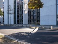 there is an empty parking area next to the building as seen from a side view