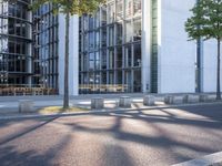 there is an empty parking area next to the building as seen from a side view
