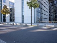 there is an empty parking area next to the building as seen from a side view