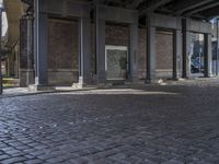 a very old building that has been completely renovated into apartments with brick flooring and floors