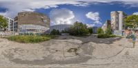 a fish eye view photo of an old abandoned building and park bench in front of some other apartment buildings