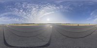 fisheye lens image with wide angle lens on asphalt field in open landscaped area