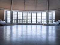 empty stage with large glass windows at an auditorium or conference venue for musicians to perform