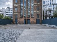 the old brick building is by itself now used as a warehouse and now art gallery