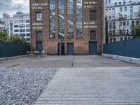 the old brick building is by itself now used as a warehouse and now art gallery