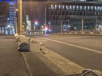 several discarded furniture sitting on the side of a street in front of a tall building