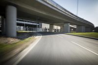 a picture of an underpassed roadway from the side view while driving in a car