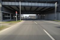 a picture of an underpassed roadway from the side view while driving in a car