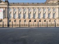 there is a large building with lots of windows in it and the dome at the top of the building is made of stone