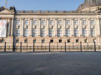 there is a large building with lots of windows in it and the dome at the top of the building is made of stone