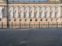 there is a large building with lots of windows in it and the dome at the top of the building is made of stone