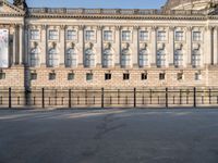 there is a large building with lots of windows in it and the dome at the top of the building is made of stone