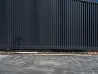 the building has several different angles on it, in varying colors and shapes with brick and concrete floors