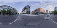 three shots are taking in one of the city streets as part of a 360 - panoramic lens