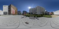 this is an image of a circular panoramic view of buildings, with a person on the street