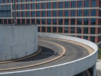 a car is driving on the highway through an underground parking garage area in a city