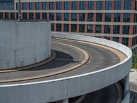 a car is driving on the highway through an underground parking garage area in a city