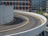 a car is driving on the highway through an underground parking garage area in a city