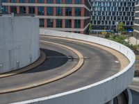 a car is driving on the highway through an underground parking garage area in a city