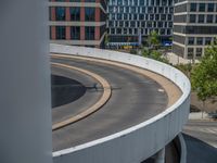 a car is driving on the highway through an underground parking garage area in a city