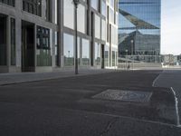 the street has an old manhole with a lot of glass windows on it and many street spaces