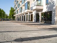 a large building has many windows and doors on both sides of the walkways, which also look very nice