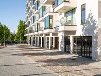 a large building has many windows and doors on both sides of the walkways, which also look very nice