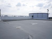 a boat is parked in an empty parking lot near an air port on the water