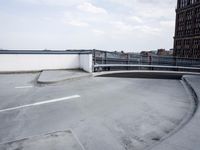 a boat is parked in an empty parking lot near an air port on the water