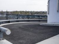 a boat is parked in an empty parking lot near an air port on the water