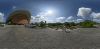 two different panoramic images of a skateboarder practicing tricks in the middle