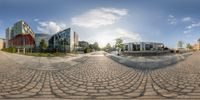 the empty city center features many nice buildings and is seen in this fish eye lens