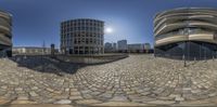 a panoramic view of the inside of a city center, taken with fish eye lens