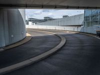 a car is driving on the highway through an underground parking garage area in a city