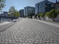 the stone path has been built along the side of the street and is lined with buildings