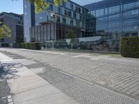 the stone path has been built along the side of the street and is lined with buildings